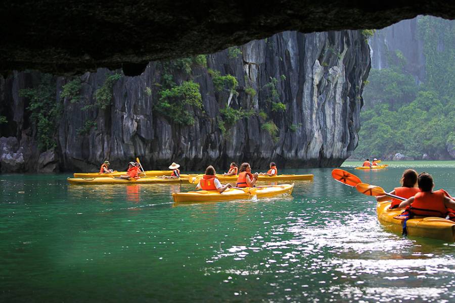 Go kayaking through emerald waters